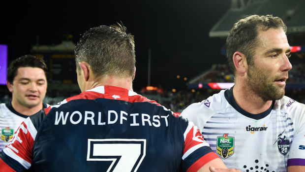 Brush off: Cooper Cronk and Cameron Smith after the Storm's win over the Roosters at Adelaide Oval last year.
