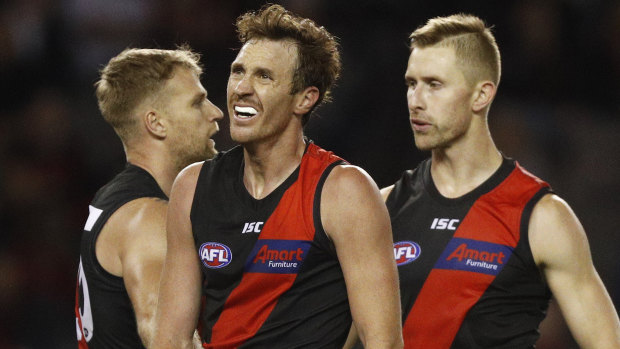 Bombing out: Dejected Essendon players, including Mitch Brown (centre) after the loss to St Kilda.
