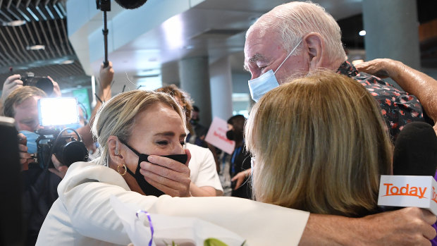 Nine Network’s Today show reporter Christine Ahern reacts to a surprise reunion with her parents Mike and Andrea Ahern after she arrived on a flight from Melbourne to report on the easing of Queensland’s border restrictions in December 2021.