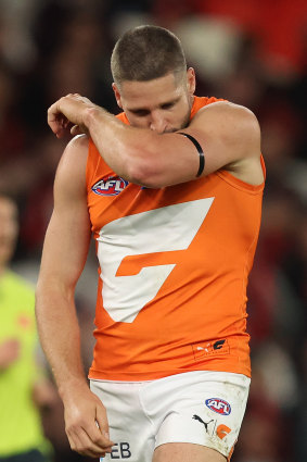 GWS forward Jesse Hogan kisses his armband on Saturday in apparent tribute to Cam McCarthy.