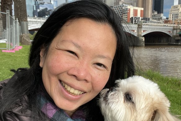 Maida Pineda with her dog Spark after moving to Melbourne.