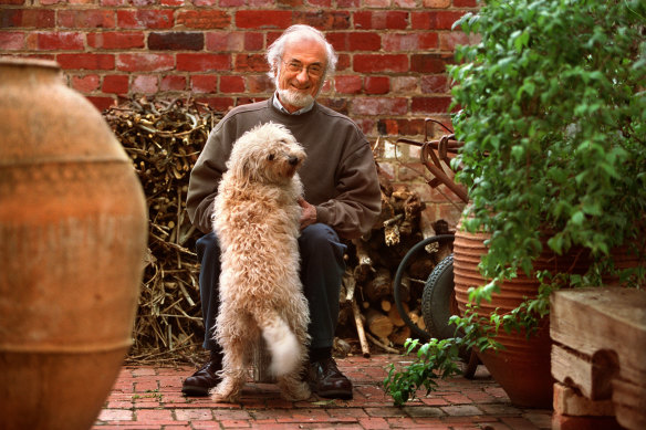 Moss Cass at home in Melbourne with his dog Milka in 2002.  