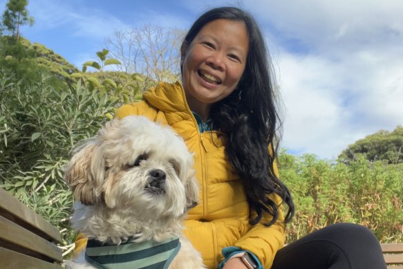 Maida Pineda with her dog, Spark, in the Royal Botanic Gardens.