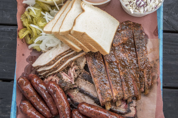 Lunch tray: pork ribs, smoked turkey, sausage, brisket and pulled pork at  Franklin Barbecue.