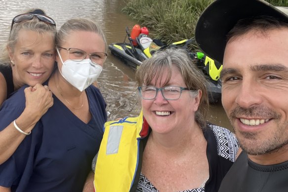 Prominent conspiracy theorist David Oneeglio takes a selfie with flood victims.