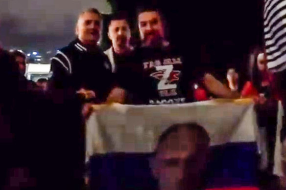 Srdjan Djokovic posing with the Russian supporters.