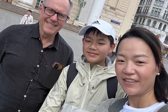 Charlie’s teacher Glenn Riddle, Charlie Wu and Charlie’s mother Ashleigh Wu outside the Bolshoi Theatre in Moscow.