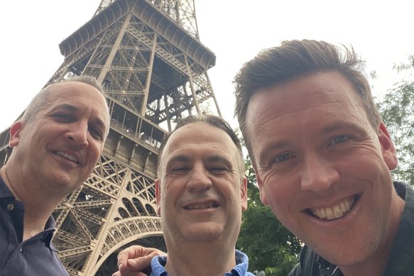 NRL bosses Andrew Abdo and Peter V’landys with Nine host James Bracey in the shadow of the Eiffel Tower.