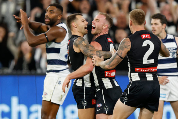 Collingwood’s Jamie Elliott (left) and Tom Mitchell celebrate.