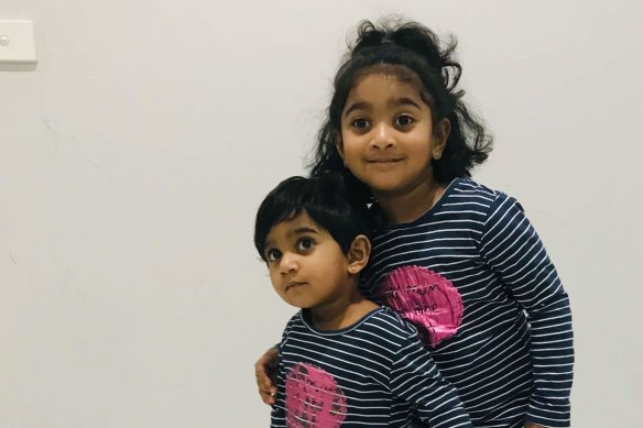 Tharunicaa, left, is pictured with her four-year-old sister Kopika.