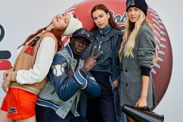 Gigi Hadid, TikTok performer Khaby Lame, Irina Shayk and German athlete Alica Schmidt at the Boss x Russell Athletic show, Milan Fashion Week. 