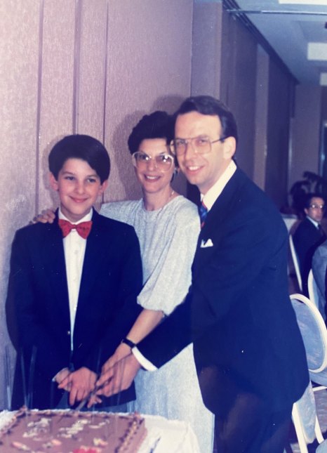 Loewenstein at his bar mitzvah with his parents in Melbourne in 1987.