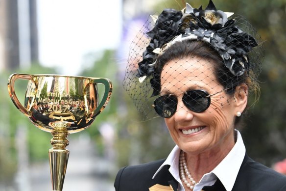 Amanda Elliott, chair of the VRC, with the Melbourne Cup trophy in 2017.
