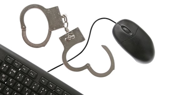 Computer keyboard and handcuffs. 