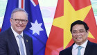 Australian Prime Minister Anthony Albanese and Vietnamese Prime Minister Pham Minh Chinh shake hands in Hanoi.