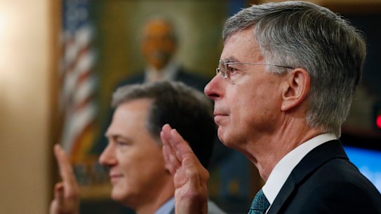 Top US diplomat in Ukraine William Taylor, right, and career Foreign Service officer George Kent, left are sworn in to testify at the first public impeachment hearings into President Donald Trump. 