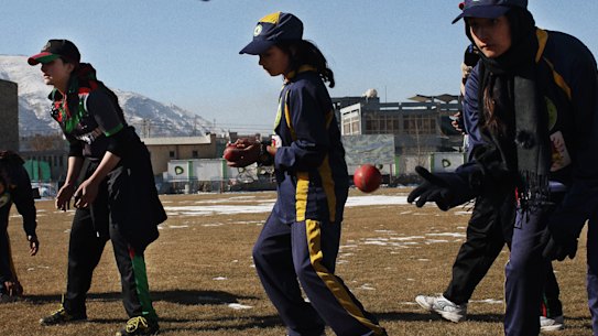 The Afghan women’s cricket team trains on a snow-covered Kabul Cricket Stadium.