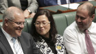 Liberal Gladys Liu is flanked by Prime Minister Scott Morrison and Treasurer Josh Frydenberg during a division in the House of Representatives after Shadow Attorney-General Mark Dreyfus moved to suspend standing orders, at Parliament House in Canberra on  Thursday 12 September 2019. 