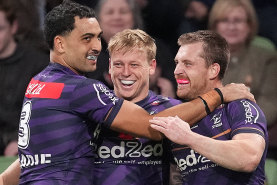 Tyran Wishart of the Storm celebrates with team mates after scoring a try during the round eight NRL match between Melbourne Storm and South Sydney Rabbitohs at AAMI Park.