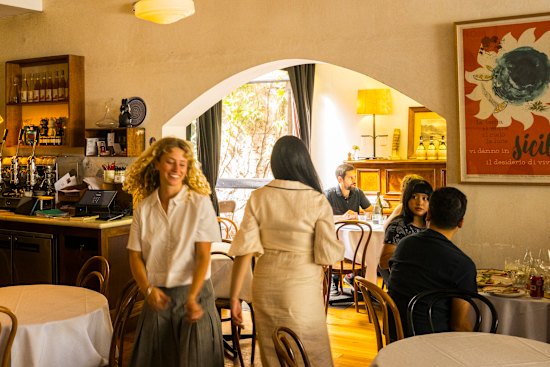 Kaprica is pure Melbourne, with high ceilings and white walls and simple wooden tables and chair.