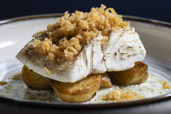 Butter-poached cod fillet topped with beer-batter bits.