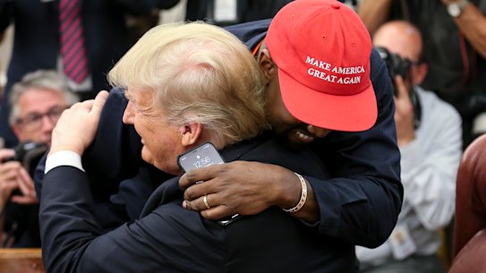 Rapper Kanye West hugs U.S. President Donald Trump during a meeting in the Oval office of the White House on October 11, 2018 in Washington, DC..