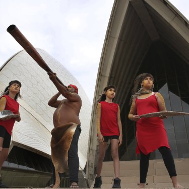 Russell Dawson with daughter Sienna (far right) and sisters Jade (far left) and Mia Welsh, part of the Koomurri dance troupe and set to perform on Australian Day.