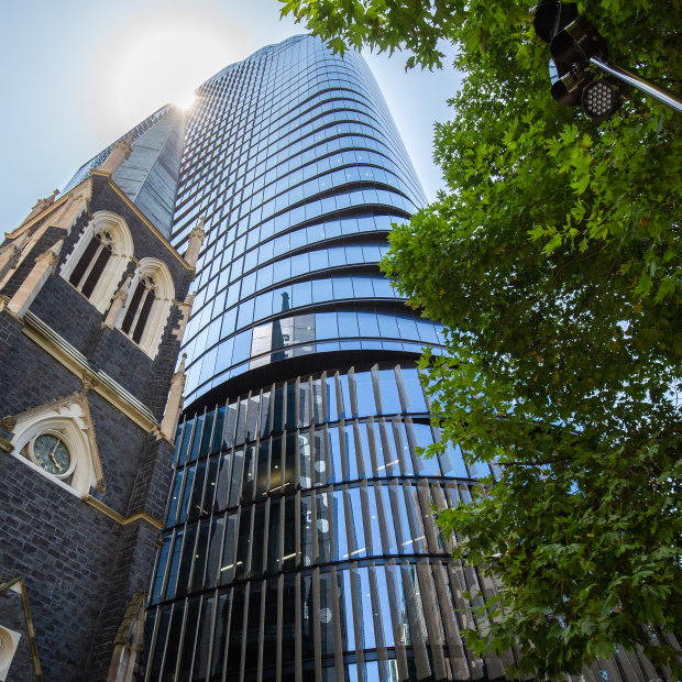 Wesley Place towers over a historic church on Lonsdale Street.