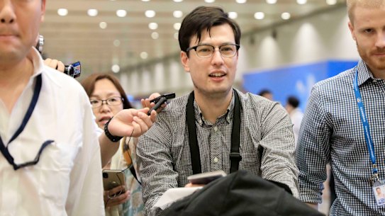 Australian student Alek Sigley arrives at Beijing airport on Thursday. 