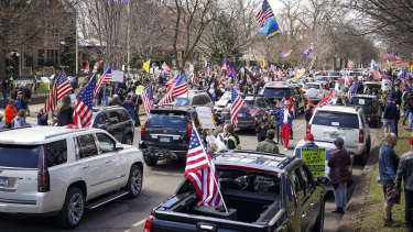 Hundreds of protesters gather outside Minnesota Govenor Tim Walz' official residence on Friday, April 17.
