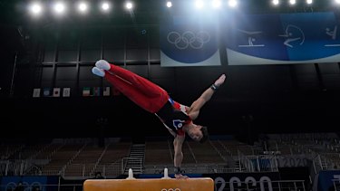 Artur Dalaloyan performs on the pommel horse.