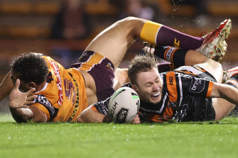 Tigers five-eighth Billy Walters wins the race to the ball to score a second-half try on Friday night.