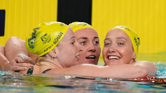 Ariarne Titmus celebrates with second placed Mollie O’Callaghan, left, and third placed Madi Wilson.