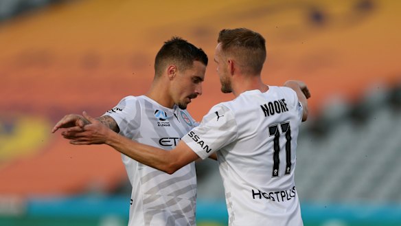 Jamie Maclaren and Craig Noone celebrate one of Maclaren's three goals.