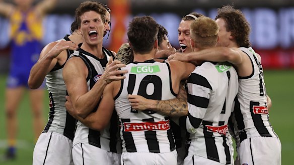 Collingwood celebrate a famous win against West Coast.