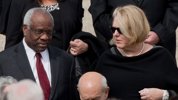 Supreme Court Associate Justice Clarence Thomas, left and his wife Virginia Thomas, right, in 2016.