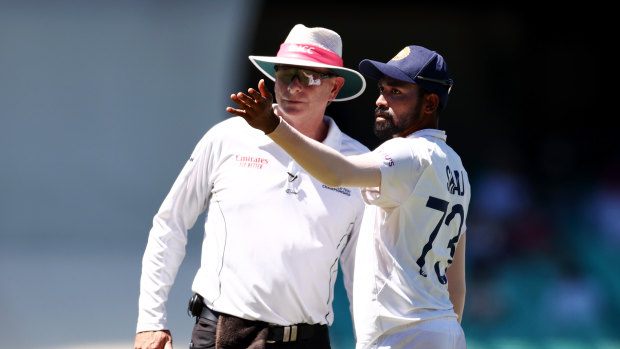 Mohammed Siraj speaks to umpire Paul Reiffel at the Sydney Cricket Ground.