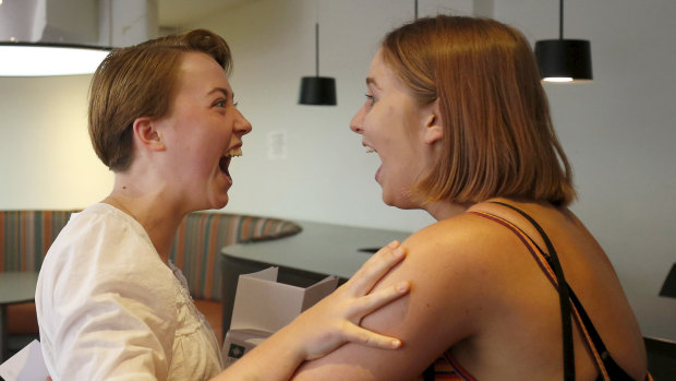 Methodist Ladies' College students Nieve Powell and Kate Morrison react after opening the envelopes containing their International Baccalaureate results.
