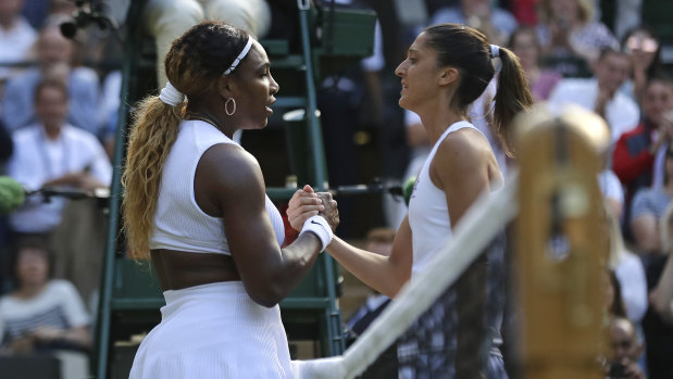 Serena Williams and Giulia Gatto-Monticone meet at the net after their match.