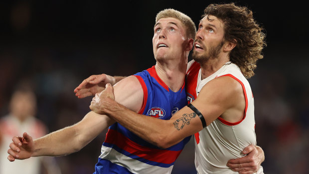 Tim English and Tom Hickey compete at a boundary throw-in during their round three clash.