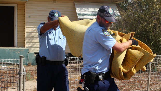 NSW Police officers from Strike Force Maluka examine Roxlyn Bowie's former house in Walgett.