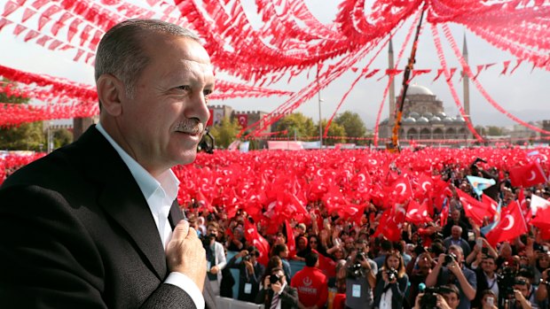 Turkey's President Recep Tayyip Erdogan gestures as he addresses supporters in Kayseri, Turkey, on Saturday.