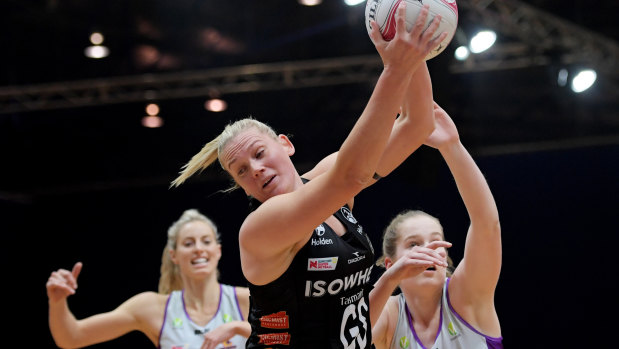 Strong grab: Caitlin Thwaites of the Magpies imposed herself in the second half against the Firebirds.