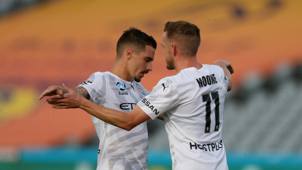 Jamie Maclaren and Craig Noone celebrate one of Maclaren's three goals.