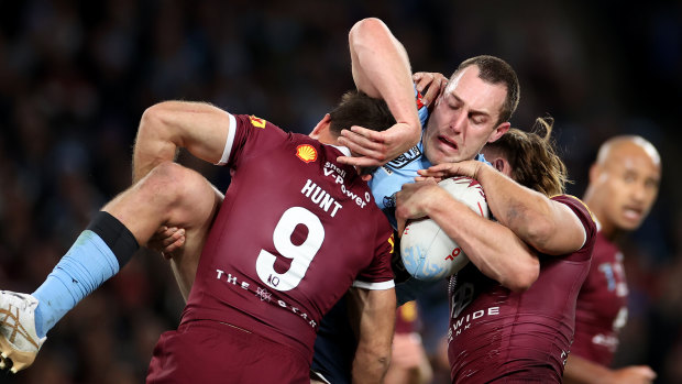 Isaah Yeo is tackled during the game.