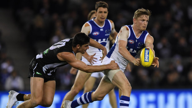 North's Jack Ziebell wins the ball from Magpie Scott Pendlebury. 