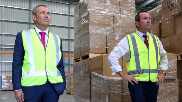 WA Premier Mark McGowan and Health Minister Roger Cook inspecting medical supplies on Monday before announcing just seven new COVID-19 infections in the state.