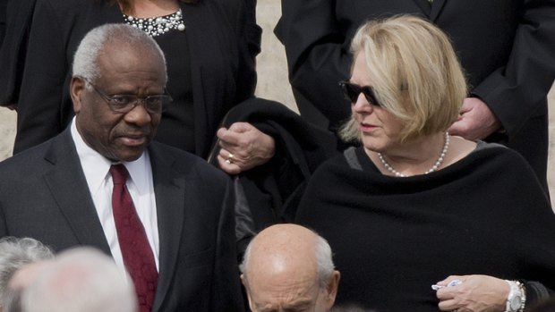 Supreme Court Associate Justice Clarence Thomas, left and his wife Virginia Thomas, right, in 2016.