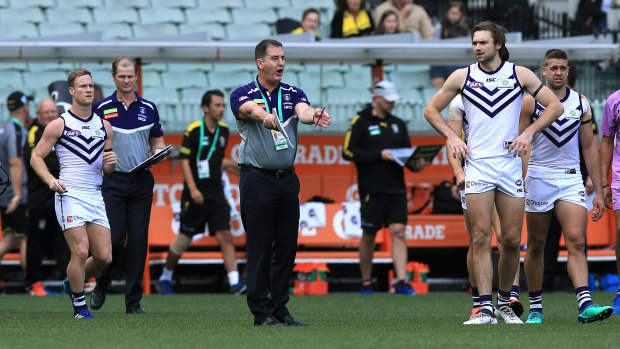 Full blast: Fremantle coach Ross Lyon gives his players some words of encouragement at quarter time against Richmond.
