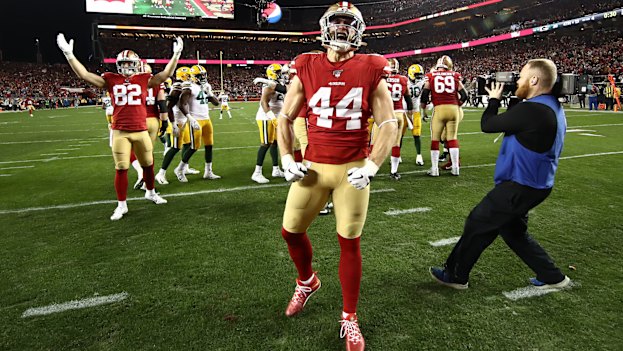 San Francisco 49ers players celebrate after qualifying for the Super Bowl by beating the Green Bay Packers.